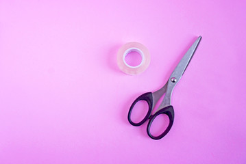 Scotch tape Scissors on the pink scene or pink background