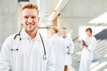 Young man as a successful medical assistant