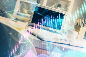 Forex market chart hologram and personal computer background. Double exposure. Concept of investment.