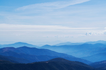 Fototapeta premium Mountain clean landscape for the background of the website landing page or booklet. Rocks and hills far in the horizon. Colored sky.