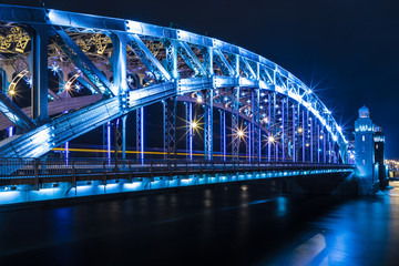 Fototapeta premium View on the Bolsheokhtinsky or Peter the Great Bridge across the Neva River in Saint Petersburg, Russia in the winter New Year or Christmas night