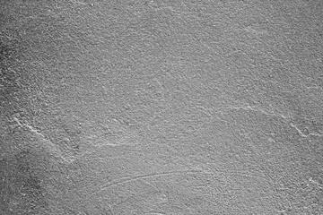 Texture of a concrete wall with cracks and scratches which can be used as a background