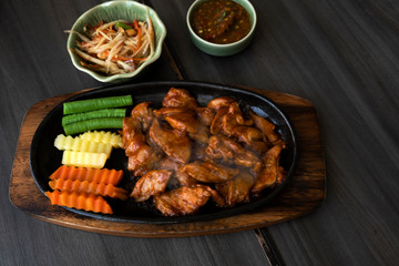 Roast pork with sauce in a hot pan of Thailand