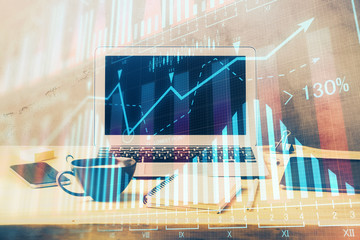 Multi exposure of graph and financial info and work space with computer background. Concept of...