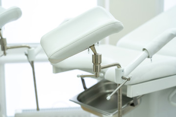 White gynecological chair in modern medical center