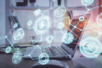 Computer on desktop with social network theme icon. Multi exposure. Concept of international connections.