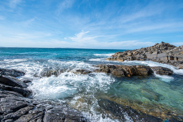 waves crashing on rocks