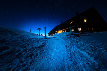 Germany, Bavaria, Allgaeu Alps, winter night scene with old mountain hut
