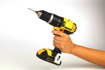A female contractor holding a cordless drill