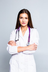 Portrait of young cheerful doctor with stethoscope isolated on white background.