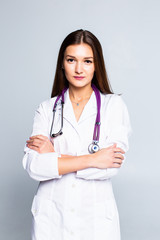 Fototapeta premium Portrait of young cheerful doctor with stethoscope isolated on white background.