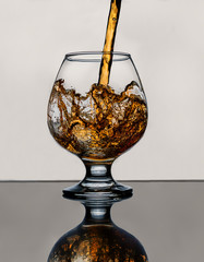Cognac pouring into a glass