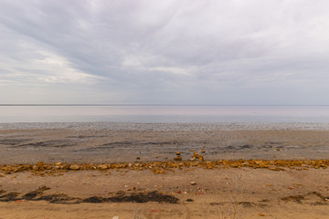 Elton Salt Lake with a pink hue of water and clouds