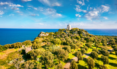 View from flying drone. Aerial spring view of Milazzo lighthouse. Picturesque morning scene of...