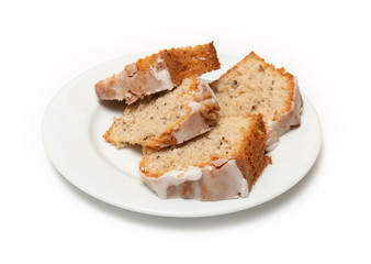 Sweetened cake on a plate with an isolated white background