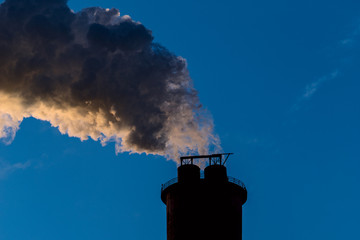 Air pollution from a pipe of an industrial plant.
