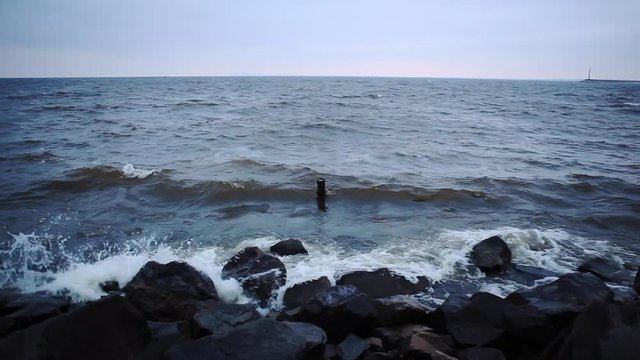 Storm on the Dnieper river in summer, cloudy sky, waves breaking on a rocky shore. City Svetlovodsk, Kirovograd region.