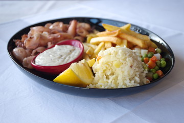 Closeup of squids with side dish on the table