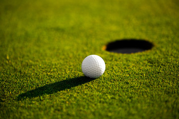 Closeup of golf ball on the grass, ready for playing professional golf