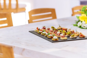 Selective focus shot of small cocktail dishes on a black tray