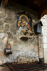The Holy water spring and icon of the Holy Virgin on territory of Serbian Orthodox monastery (cloister) Moracha in Montenegro