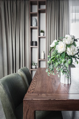 dining room interior with bouquet of white flowers 