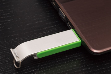 USB memory stick - Metal flash drive connected to a laptop