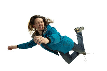 A second before falling. Caucasian young man falling down in moment with bright emotions and facial...