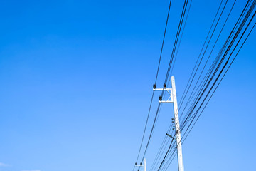 Messy electrical cables in thailand - many lines of cables chaotic set of interwoven, optical fiber technology open air outdoors.