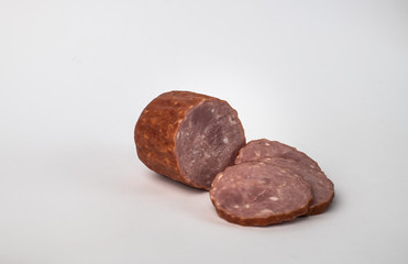 slices of Krakow sausage isolated on a white background
