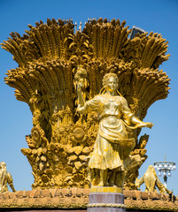 Fototapeta na wymiar Russian Golden Fountain of friendship in VDNKH , Moscow Russia made of gold 