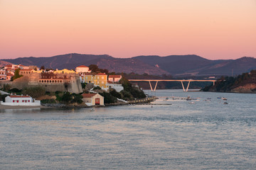 View of Vila Nova de Milfontes with river Mira at sunset, in Portugal