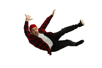 A second before falling. Caucasian young man falling down in moment with bright emotions and facial...