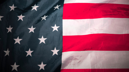 American flag. Closeup of United States flag. The camera flies over the lying, wavy flag of the United States of America. Background.View from above. The concept of patriotism and freedom.