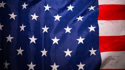 American flag. Closeup of United States flag. Over the lying, wavy flag of the United States of America. Red and white stripes.Background.View from above. The concept of patriotism and freedom.