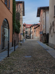 pavement made with river pebbles, stones with rounded edges, in the center of Arona.Italy