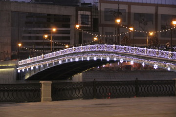 The bridge is decorated with garland for the new year