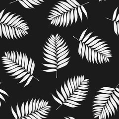 Palm white leaves on the black background. Seamless pattern with tropical plants. Hand Drawn textures. Ideal for web, card, poster, cover, invitation, brochure. Isolated.
