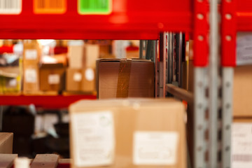 Modern warehouse shelves with pile of cardboard boxes