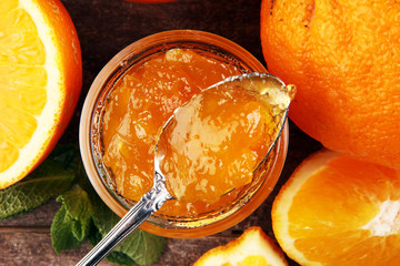 Fototapeta na wymiar orange homemade jam marmelade in a glass jar. orange marmelade