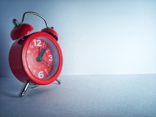 alarm clock on red background