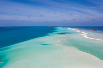 Beautiful aerial view of Maldives sandbank and tropical sea. Exotic aerial landscape. Travel and vacation concept