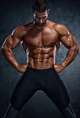 Obraz na płótnie Canvas Muscular Men Posing and Flexing Muscles
