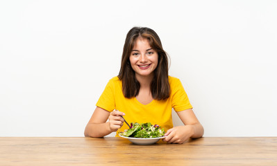 Caucasian girl with salad