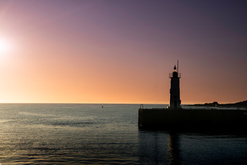 Anstruther, Fife, Scotland. Harbour village lighthouse at sunset.