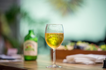 glass of white wine on table in restaurant