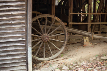 Fototapeta na wymiar Wagon wheel in a barn
