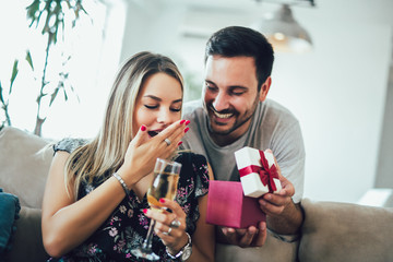 Happy young couple having romantic day at home.