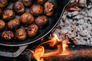 Roasted chestnuts on camping background