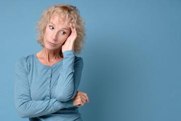 serious senior woman feeling worried about problems, pensive upset sad middle aged lady looking...